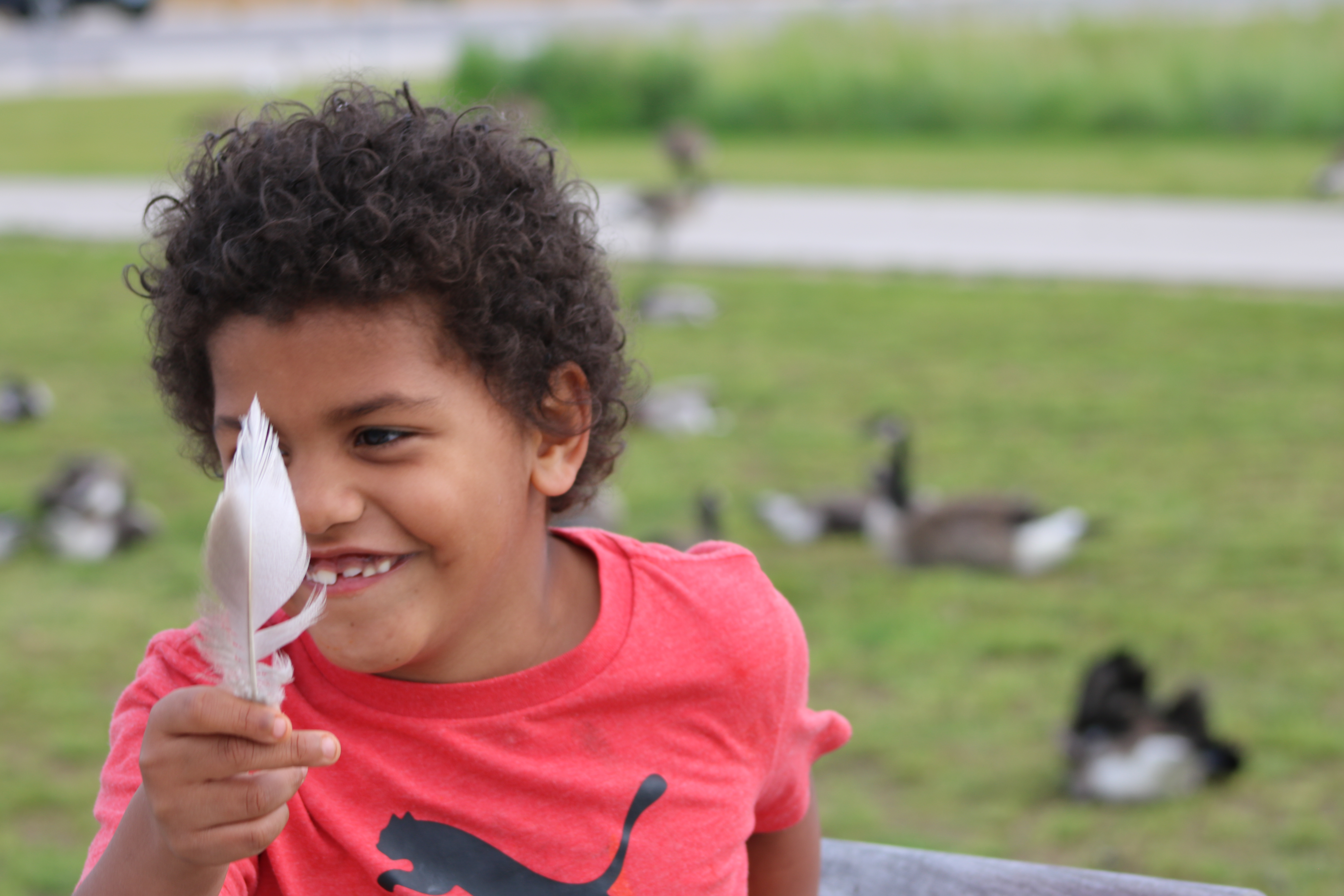 Kid Holding Feather