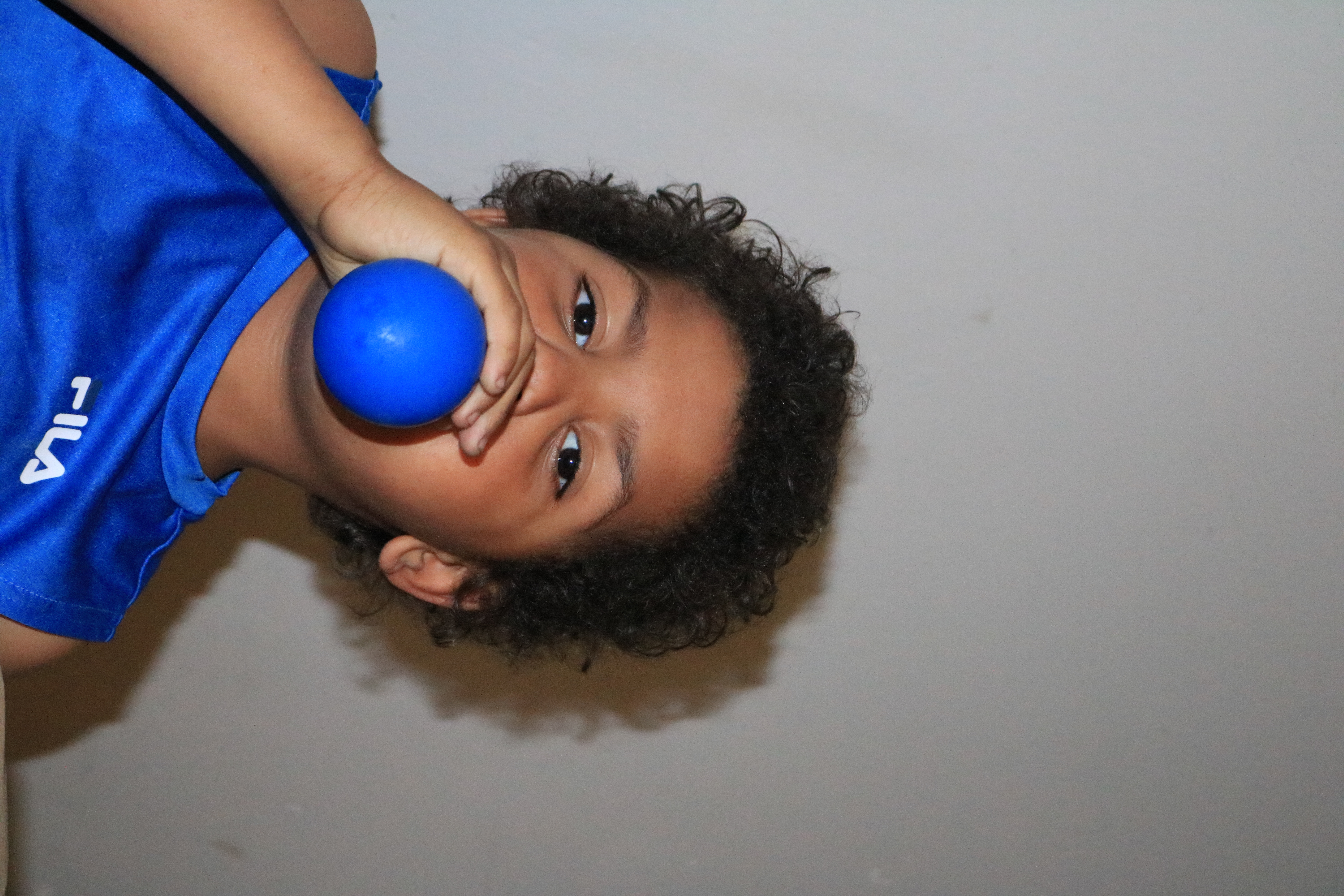 Kid Blowing A Balloon